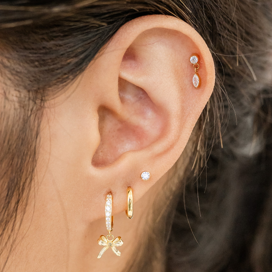 Bow Huggies – Sterling Silver Hypoallergenic Hoop Earrings